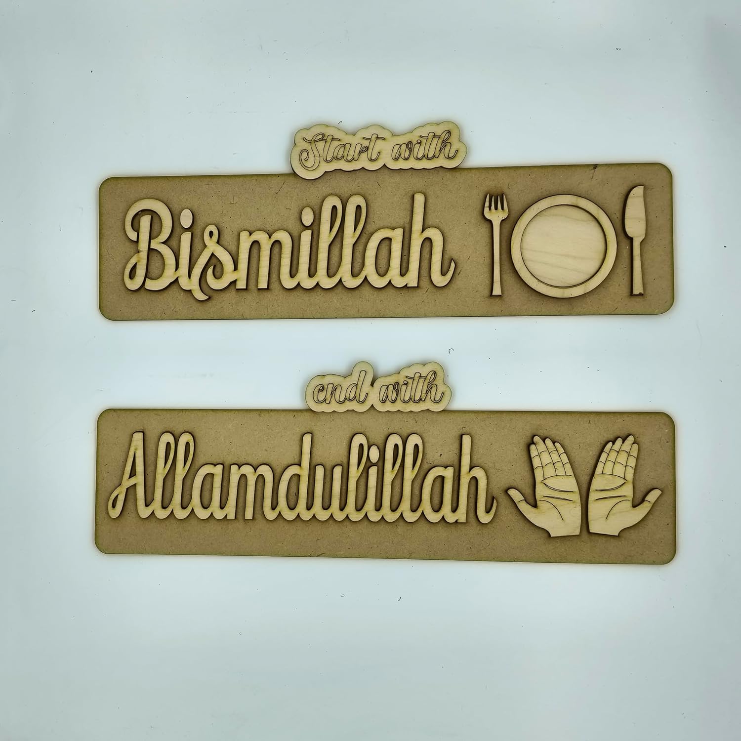 Two wooden signs with engraved text and symbols on a white background
