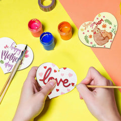Heart-shaped cards being decorated with 'love' and 'Happy Mother's Day' text on a colorful background.