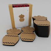 Set of cardboard pineapple-shaped coasters with a decorative box on a white background