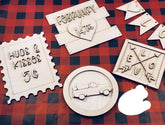 Wooden stamps with various designs on a red and black checkered background