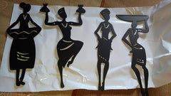 Black silhouette figures of women holding trays on a white sheet