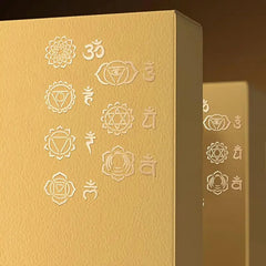 Gold box with embossed symbols on a brown background