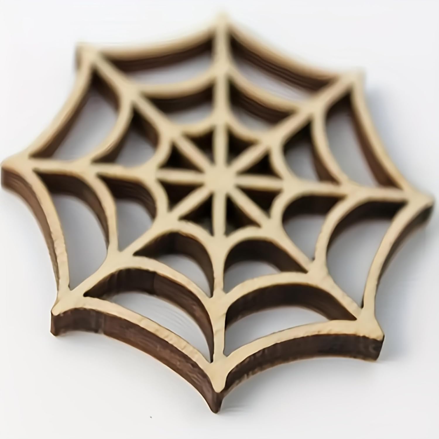 Wooden spider web cutout on a white background
