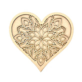 Decorative heart-shaped wooden cutout with intricate patterns on a white background