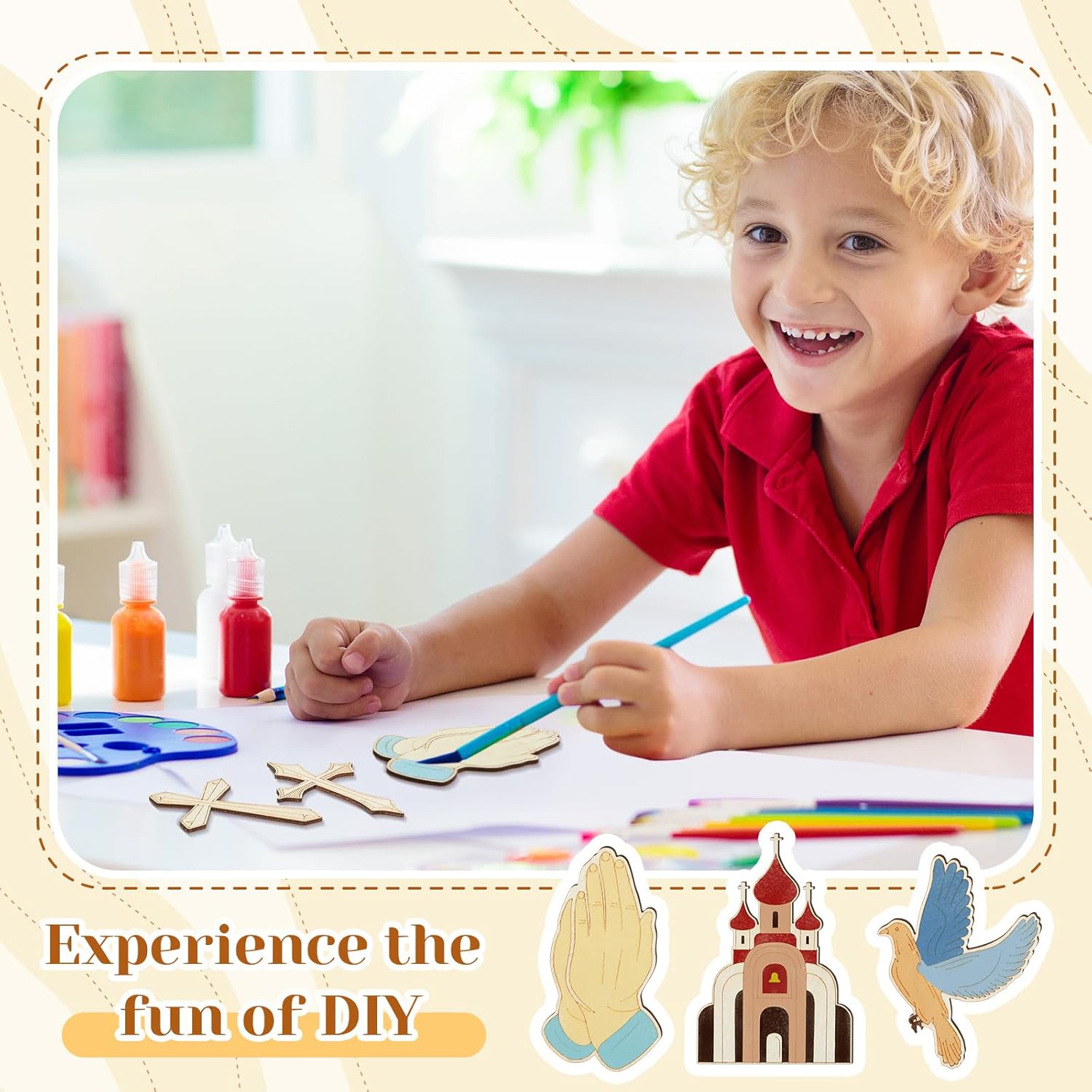 Child in a red shirt sitting at a table with art supplies, smiling.