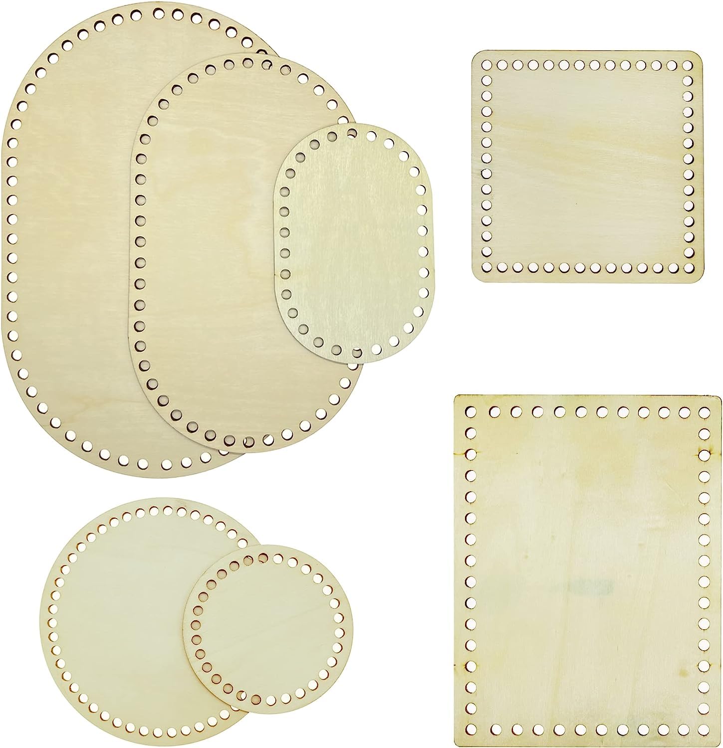 Set of wooden coasters with decorative holes on a white background