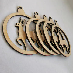 Set of wooden deer-shaped cutouts on a light gray background