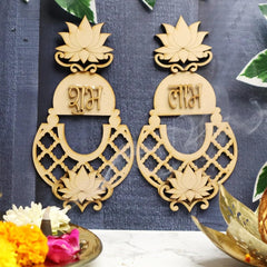 Decorative earrings with intricate designs and text on a dark background