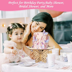 Woman and child at a table with a decorative cake stand featuring butterfly designs.