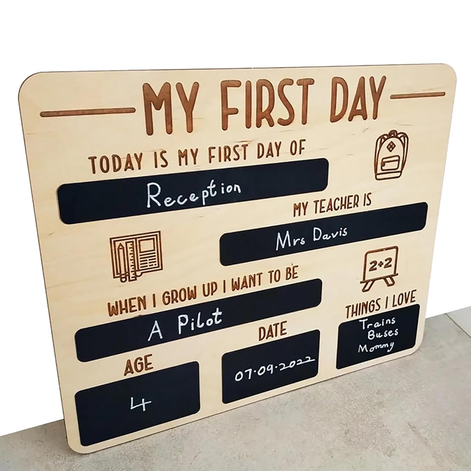 Wooden plaque with chalkboard sections for a child's first day of school details.
