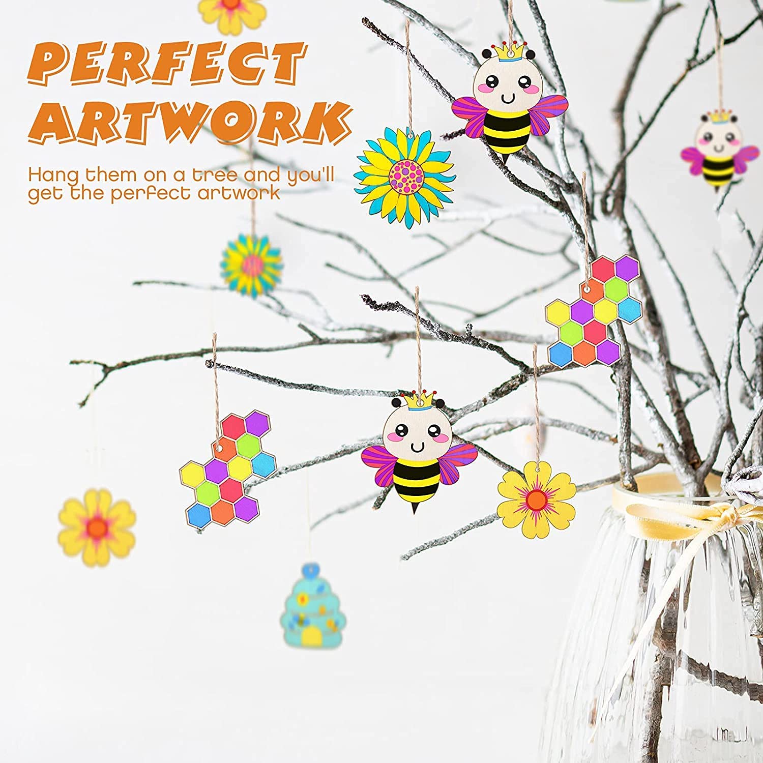 Colorful bee and flower decorations hanging on a tree branch with text 'Perfect Artwork'.