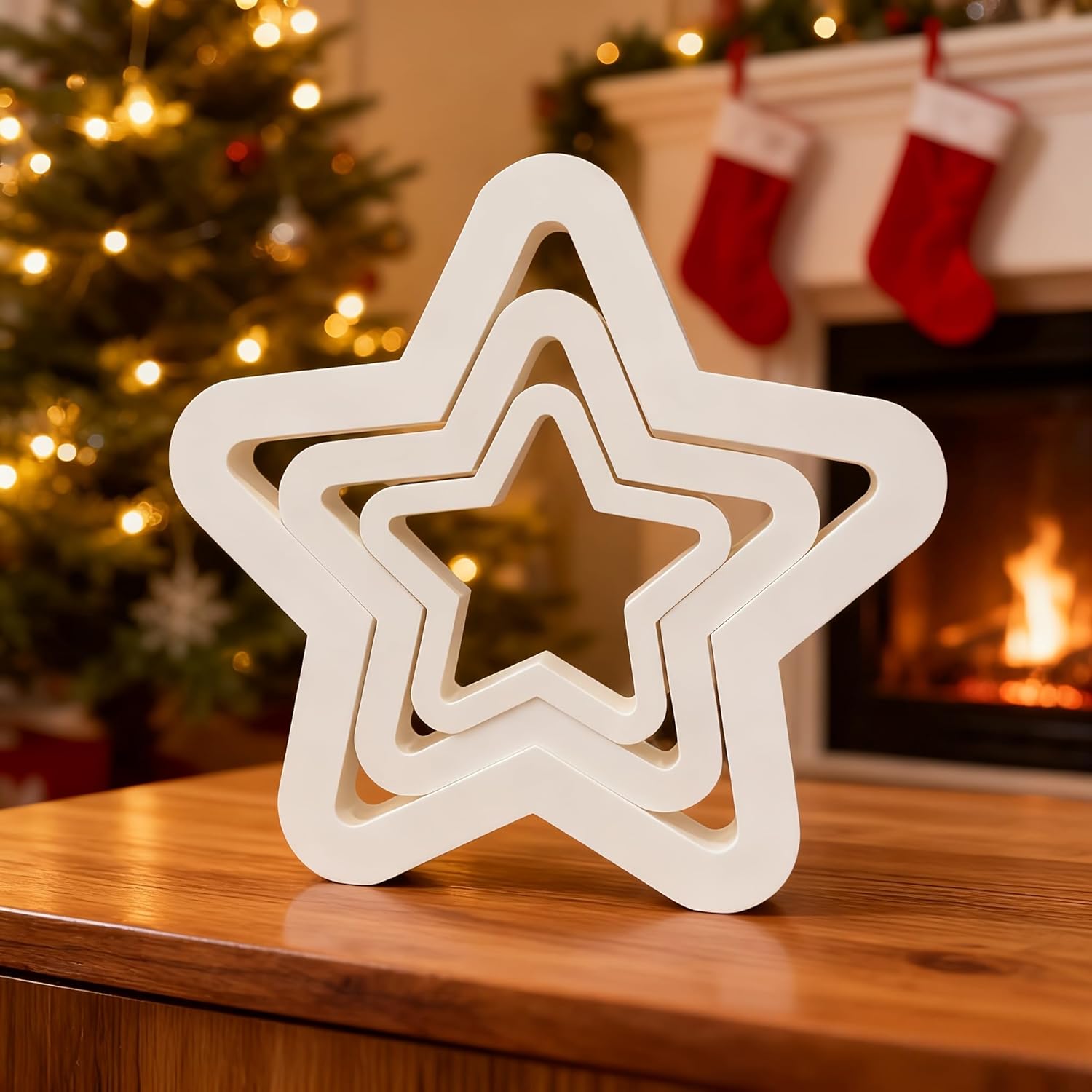 Stack of white star-shaped objects on a wooden surface with Christmas decorations in the background.