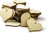 Stack of wooden heart-shaped tags on a white background