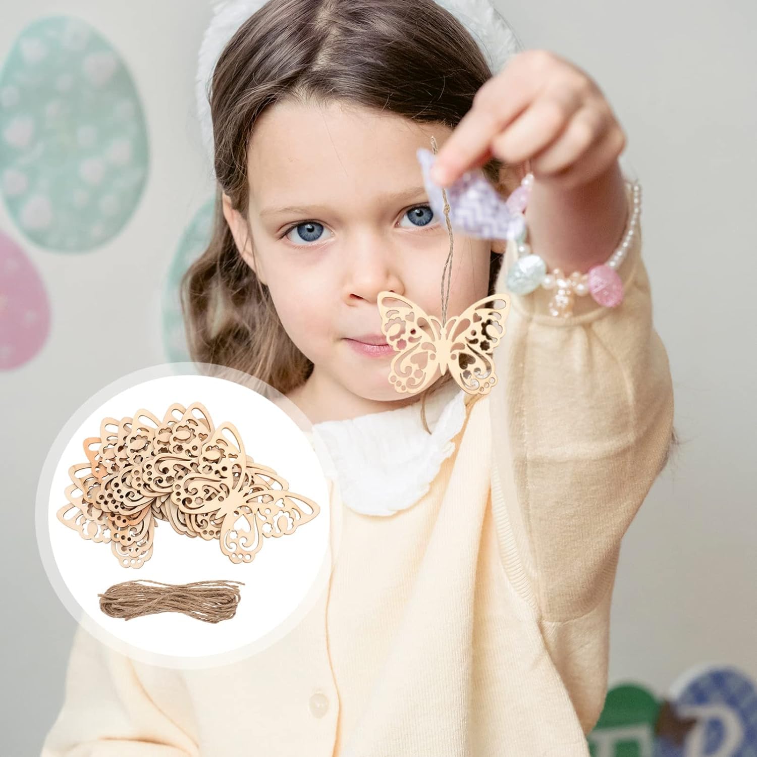 Child holding a decorative butterfly with a close-up inset of similar decorations.