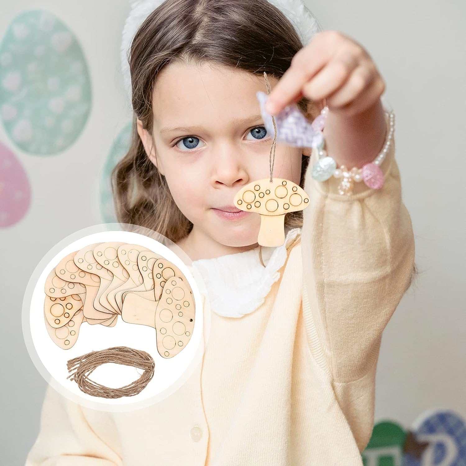 Child holding a wooden craft project with an inset showing the design details.