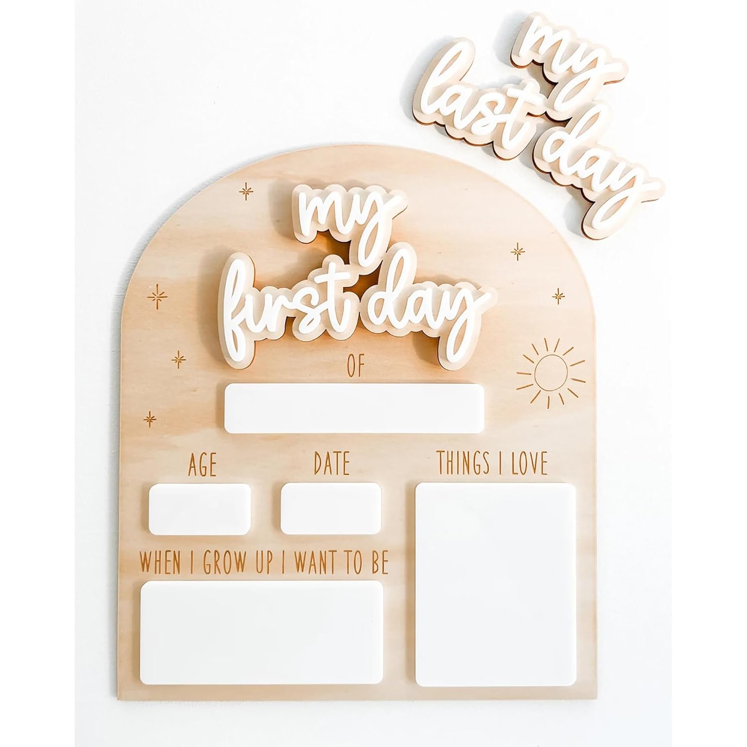 Wooden plaque with cut-out letters spelling 'my first day' and 'my last day' on a white background.