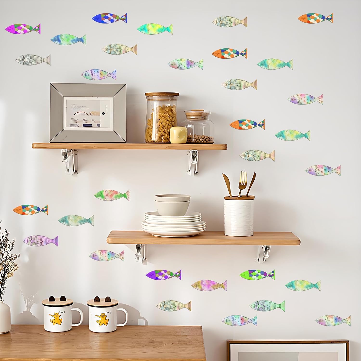 Kitchen shelves with colorful fish decals on a light gray wall.