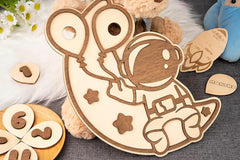 Wooden toy mouse with attached numbers on a textured surface with flowers and another toy in the background.