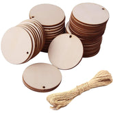 Stacks of round wooden tags with string on a white background