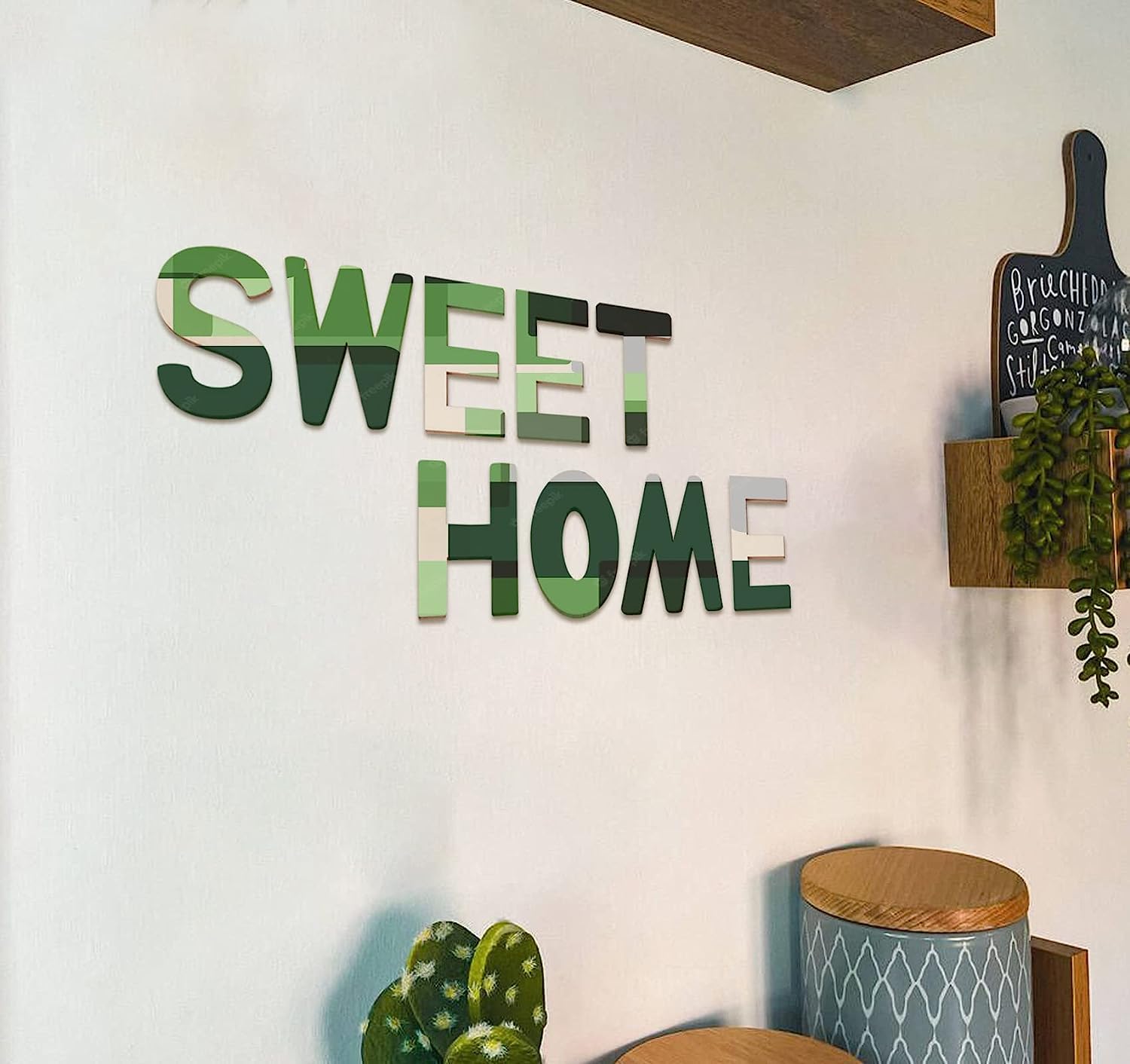 Decorative wall art with 'SWEET HOME' on a white wall.