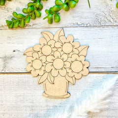 Wooden cutout of a sunflower bouquet on a wooden surface