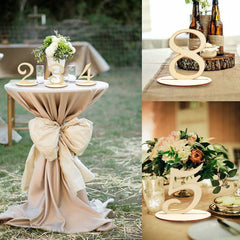 Decorative table setup with floral arrangements and table numbers outdoors.