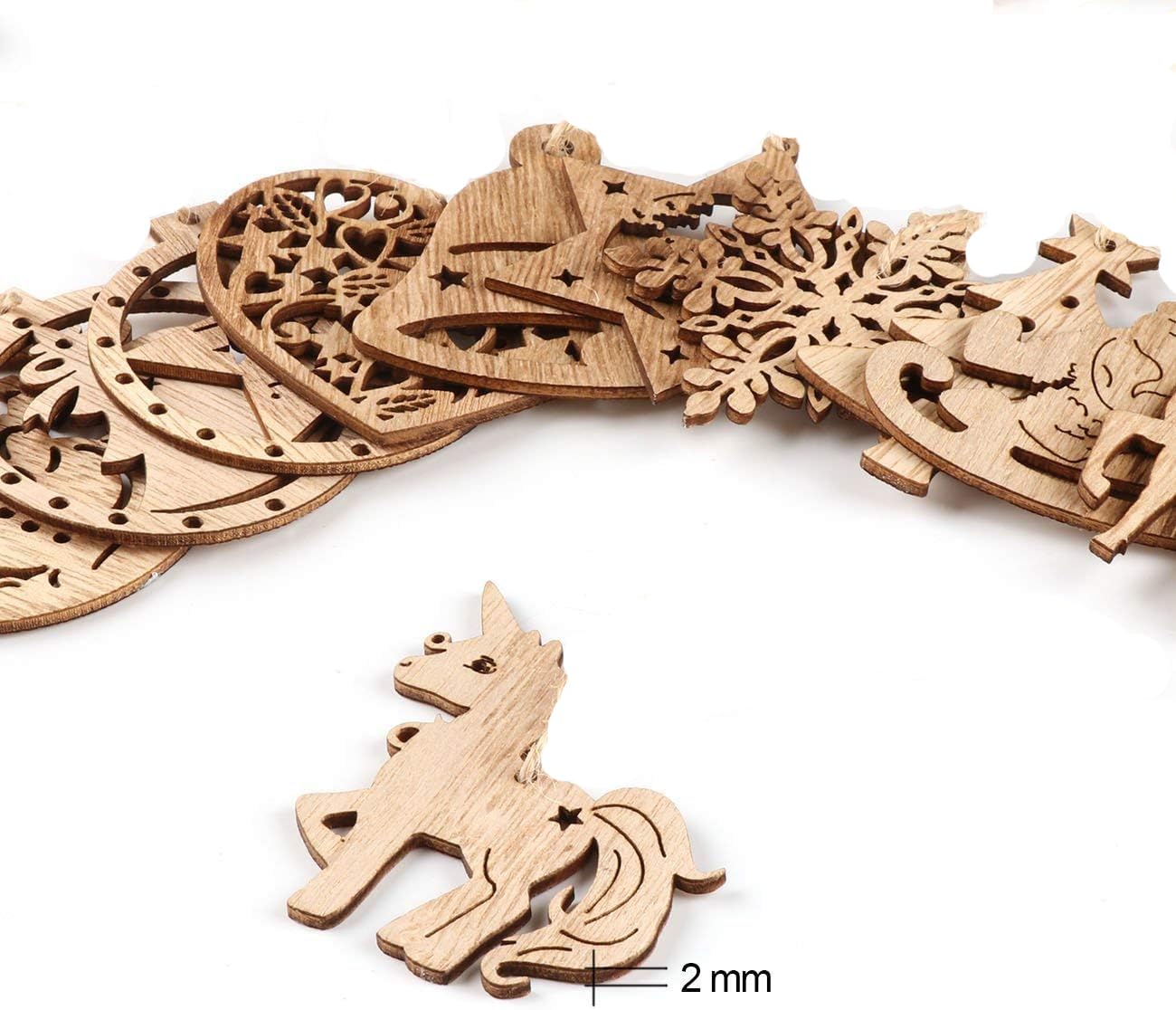 Wooden decorative pieces with intricate cutouts on a white background