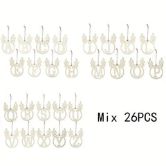 Set of 26 white letter-shaped ornaments with deer antlers on a white background.