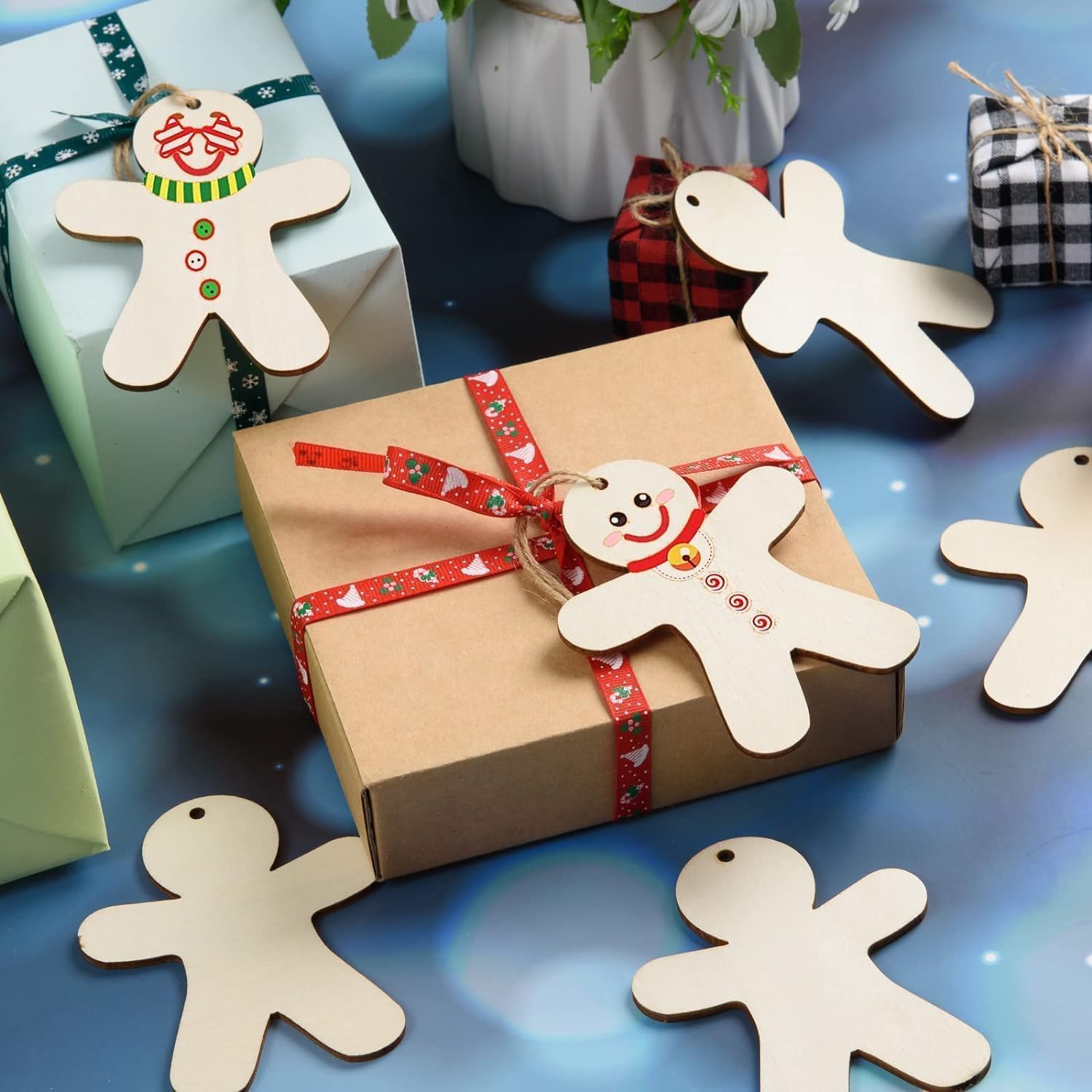 Gift box with gingerbread man decorations on a blue background