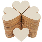 Stack of wooden heart shapes on a white background