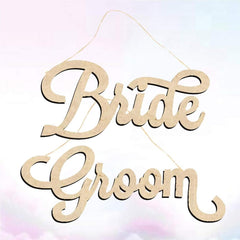 Wooden sign with 'Bride' and 'Groom' text on a light background