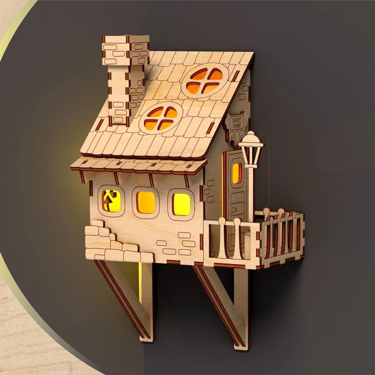 Wooden model of a house with a dark background
