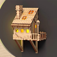 Wooden model of a house with a dark background