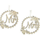 Decorative wreaths with 'Mr' and 'Mrs' text on a white background