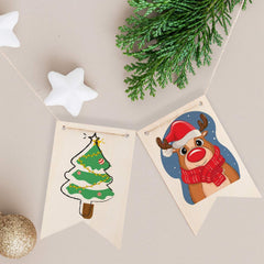 Two Christmas-themed cards with a reindeer and a tree on a beige background with greenery and stars.