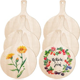 Set of wooden cutting boards with floral designs and 'Nature is food' text on a white background