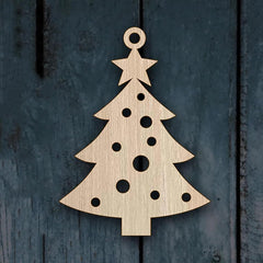 Wooden Christmas tree ornament on a textured dark blue background