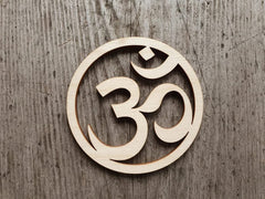 Wooden Om symbol on a wooden background