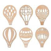 Set of six wooden hot air balloon cutouts with different designs on a white background