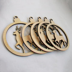 Set of wooden deer-shaped ornaments on a light gray background