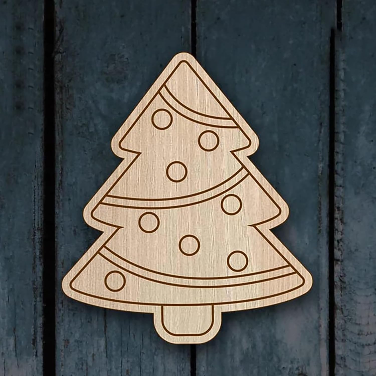 Wooden Christmas tree decoration on a wooden background
