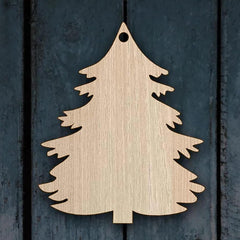 Wooden Christmas tree decoration on a dark wooden background