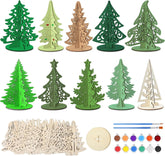 Set of decorative Christmas trees in various designs and colors with painting supplies on a white background.