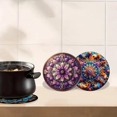 Colorful mandala coasters on a kitchen counter with a pot of food.
