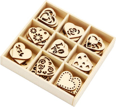 Set of wooden heart-shaped cutouts in a box on a white background