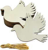 Wooden dove ornaments with string on a white background