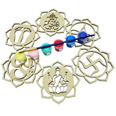 Wooden mandala cutouts with paint and brushes on a white background