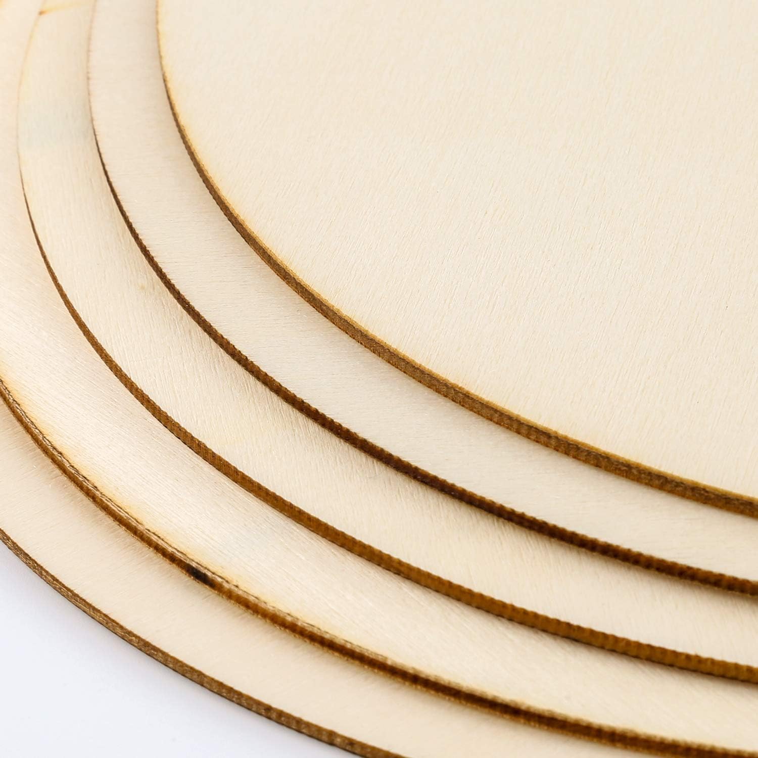 Close-up of wooden circular cutouts with a plain background