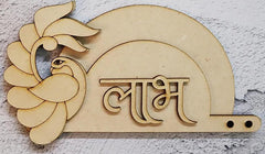 Wooden decorative item with a peacock design and engraved text on a textured surface