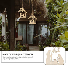 Decorative nativity scene hanging outside a thatched-roof building with plants.